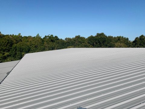 Metal roof coating commercial building